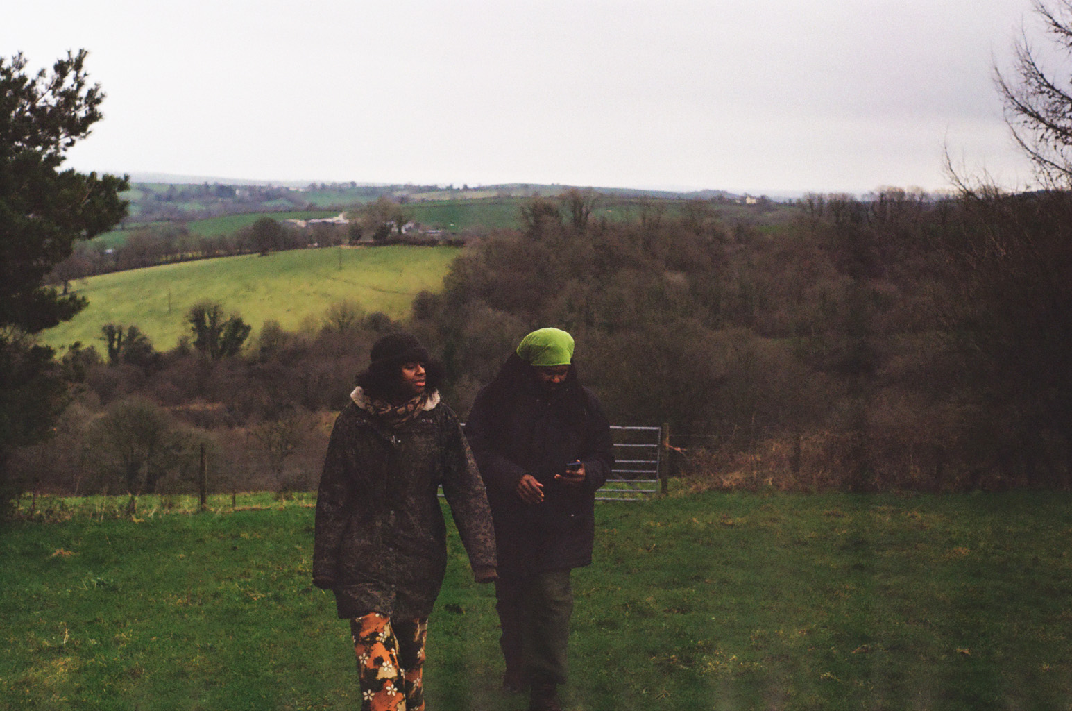 Danny and Tenesia walking in a field