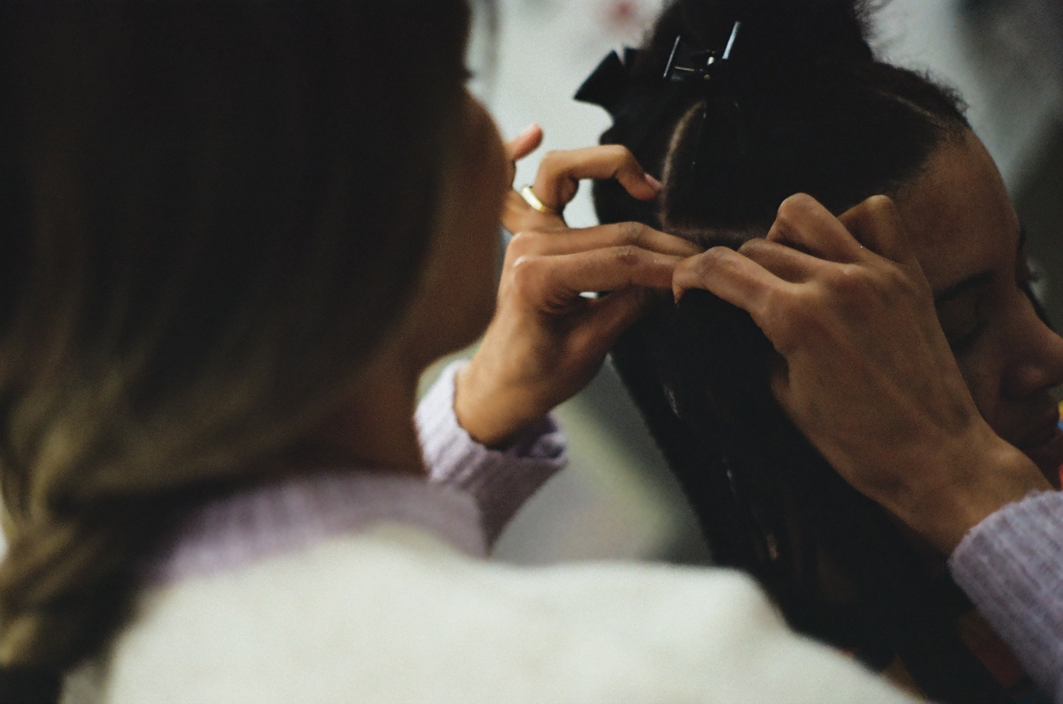 Sissi working carefully on hair