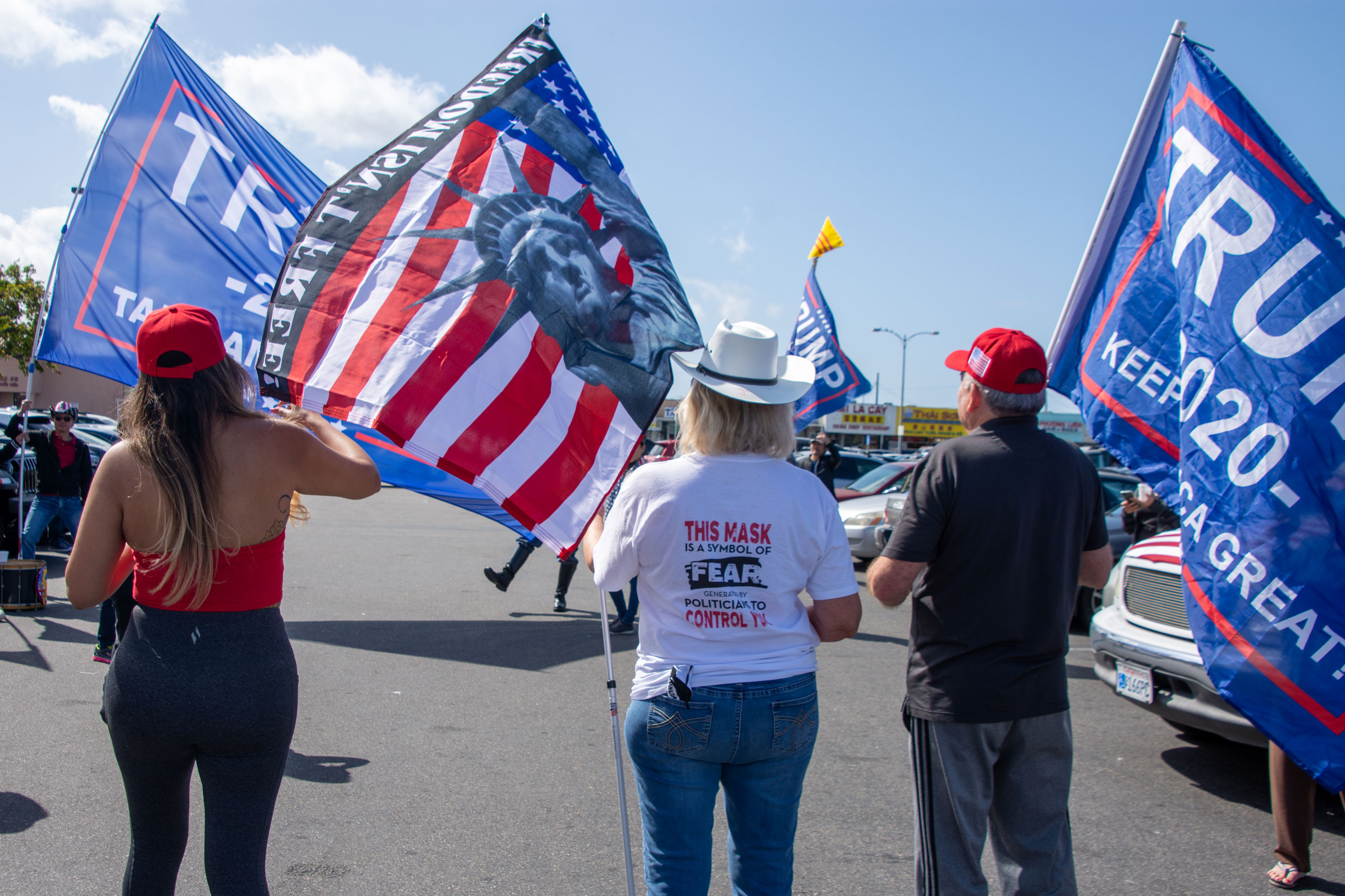 Anti-mask Trump supporter in Orange County’s Westminster prepares to drive to freedom rally in Huntington Beach.